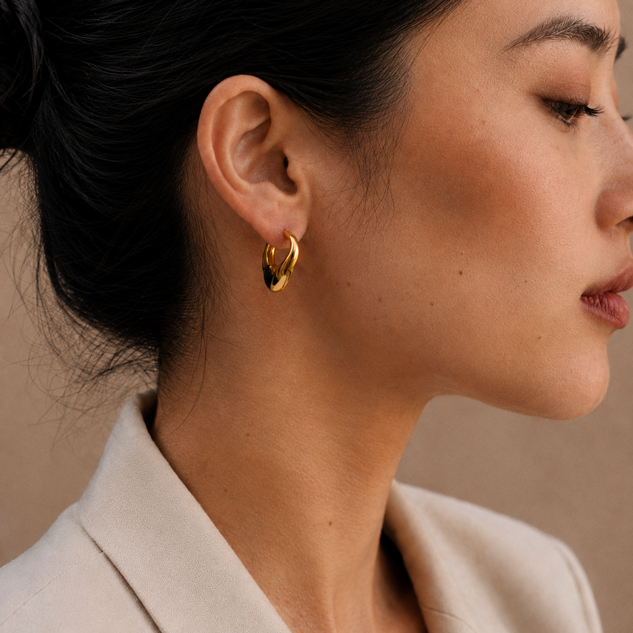  Model wearing the Adele Dome Hoops — chunky 18K gold dome hoops — Zoé Jewelry