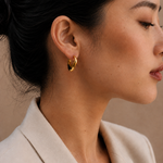 Model wearing the Adele Dome Hoops — chunky 18K gold dome hoops — Zoé Jewelry.