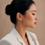  Model wearing the Adele Dome Hoops — chunky 18K gold dome hoops — Zoé Jewelry.