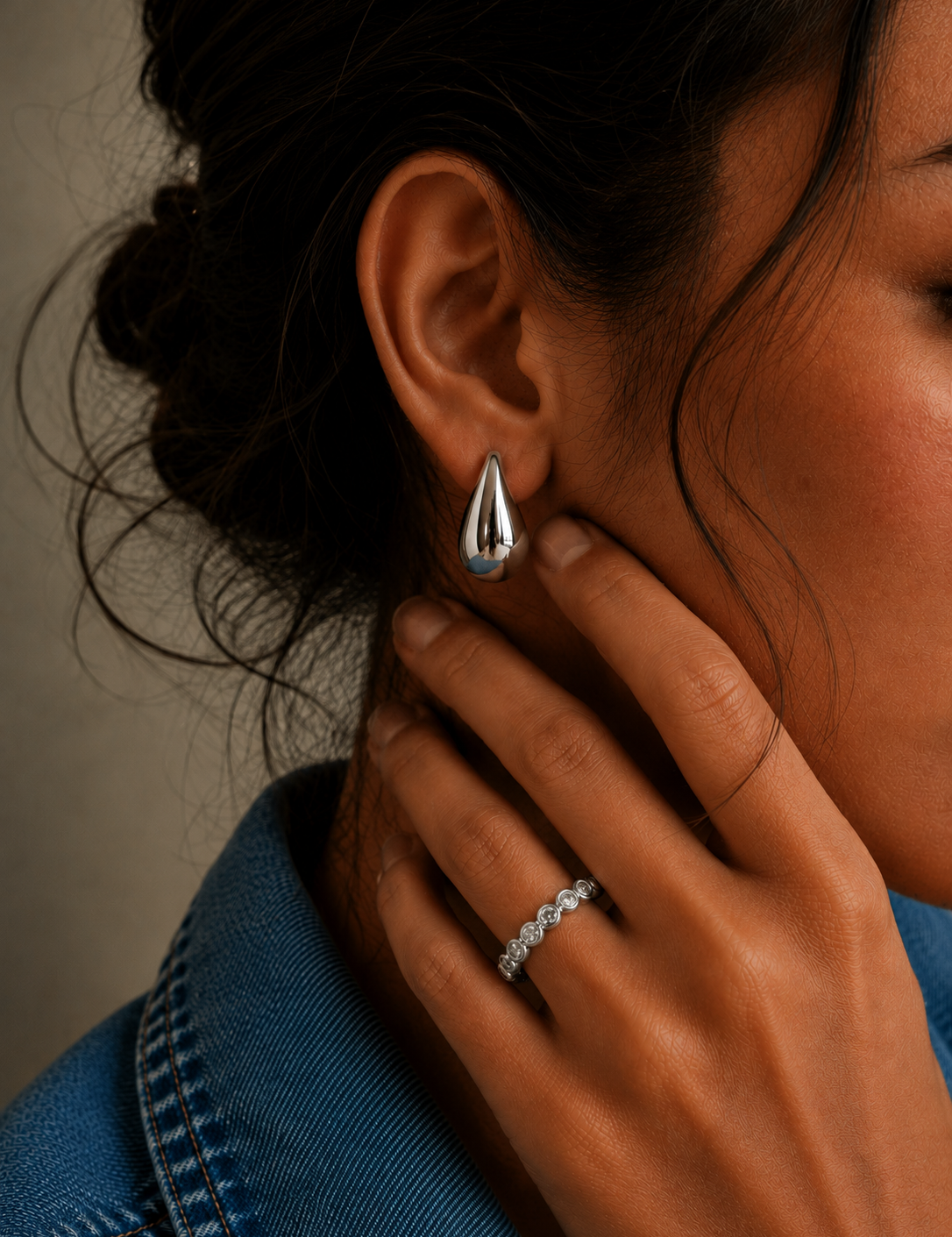 Arden Ring in a silver-tone finish with an emerald-cut cubic zirconia stone in a bezel setting, adjustable ring from Zoé Jewelry.