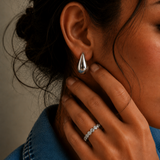 Arden Ring in a silver-tone finish with an emerald-cut cubic zirconia stone in a bezel setting, adjustable ring from Zoé Jewelry.