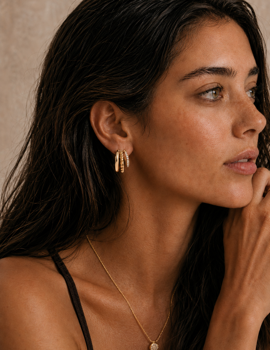  Model wearing the Blaire Layered Hoops — triple-row 18K gold hoops with smooth, twisted rope, and pavé CZ rows — Zoé Jewelry