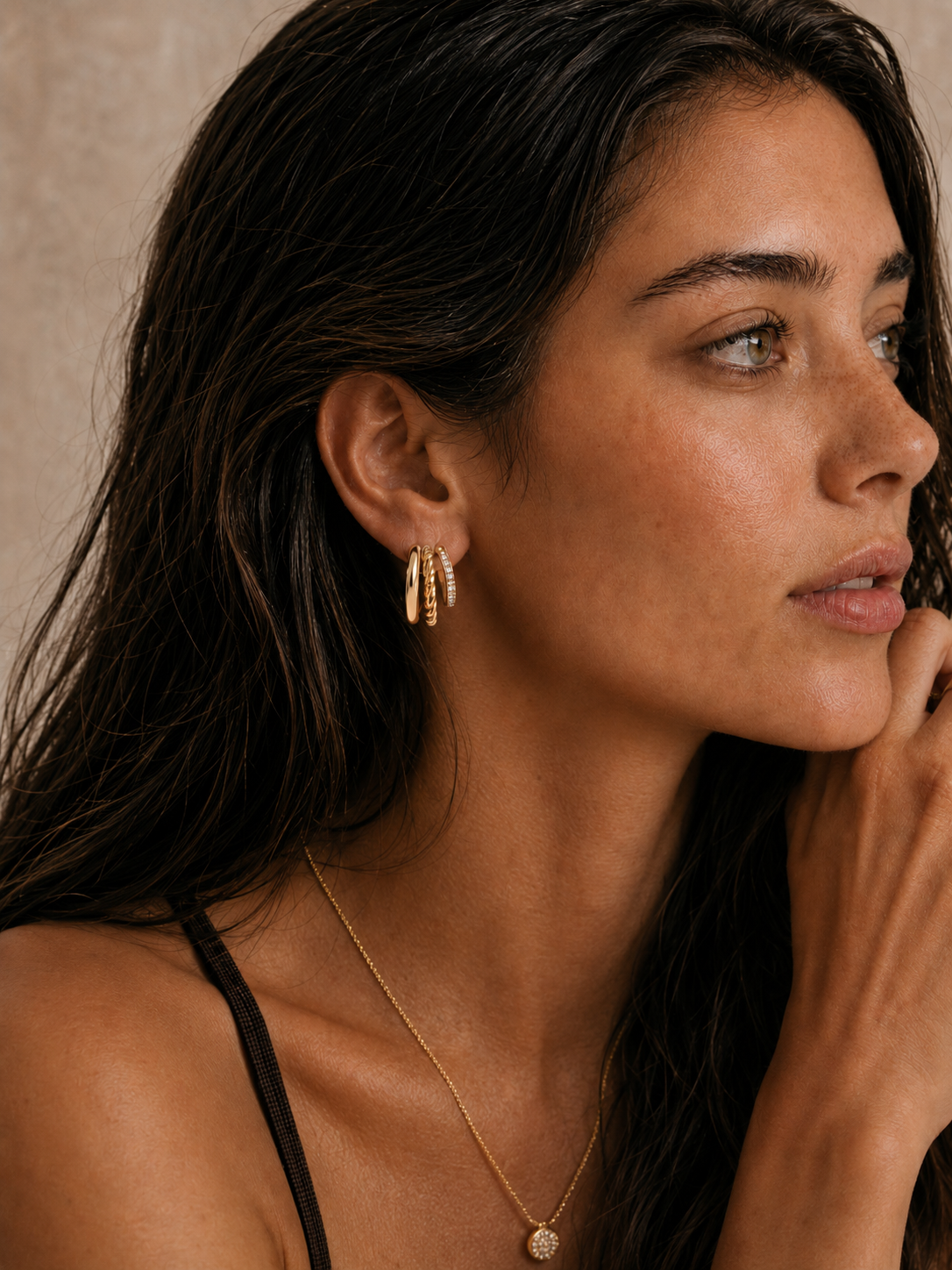  Model wearing the Blaire Layered Hoops — triple-row 18K gold hoops with smooth, twisted rope, and pavé CZ rows — Zoé Jewelry