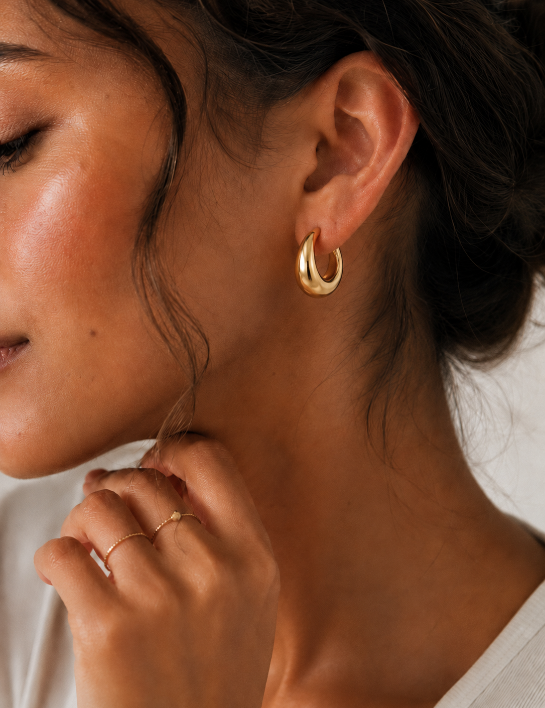  Model wearing the Eden Earrings — chunky gold dome hoops — Zoé Jewelry.