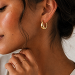  Model wearing the Eden Earrings — chunky gold dome hoops — Zoé Jewelry.