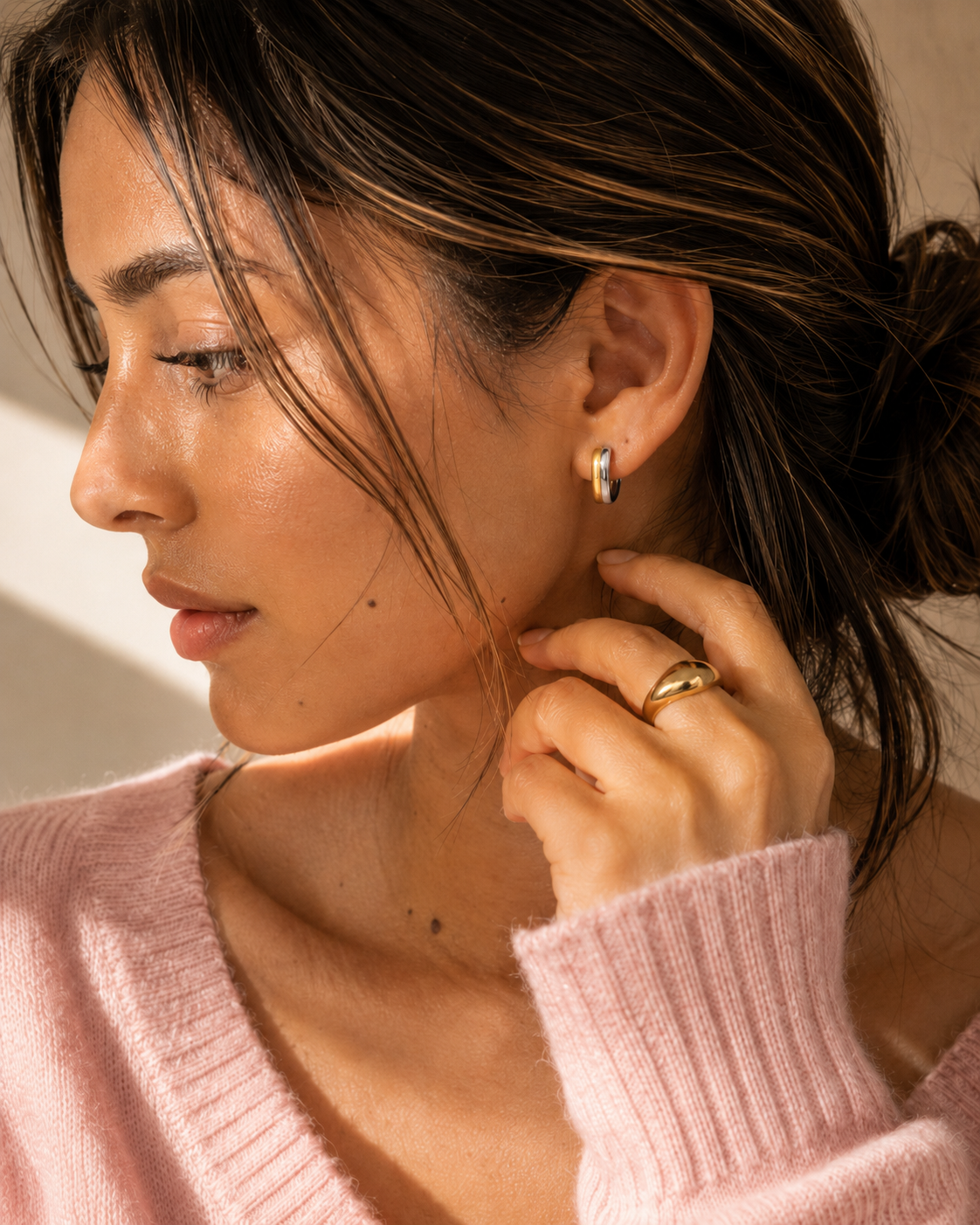 Model wearing the Equinox Hoops — two-tone gold and silver chunky hoops — Zoé Jewelry.