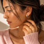 Model wearing the Equinox Hoops — two-tone gold and silver chunky hoops — Zoé Jewelry.