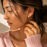 Model wearing the Equinox Hoops — two-tone gold and silver chunky hoops — Zoé Jewelry.
