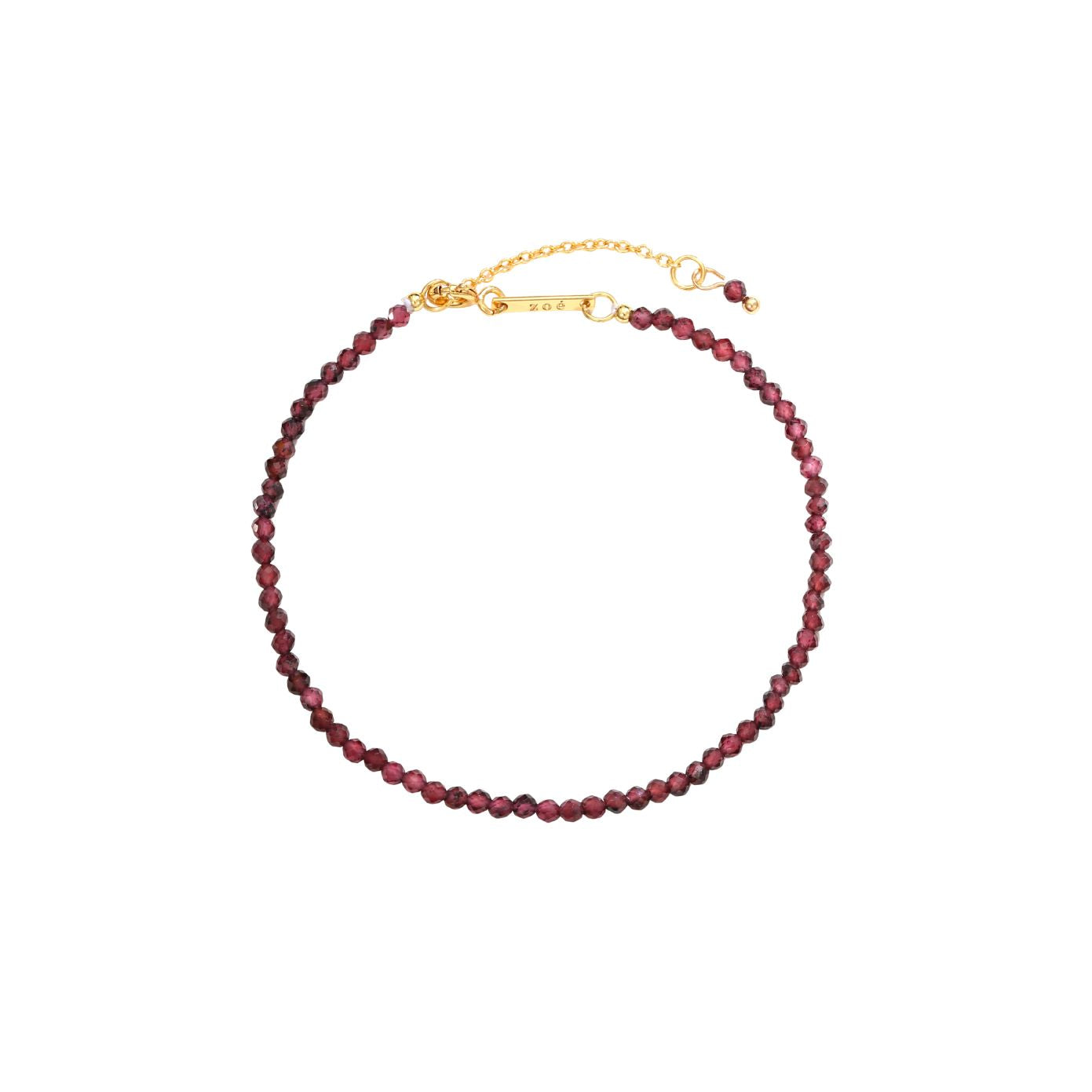 Garnet Bracelet, faceted deep-red garnet gemstone beads on an 18K gold-plated chain with a Zoé bar tag.
