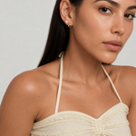 Model wearing the Heart Studs — dainty gold heart stud earrings — Zoé Jewelry.
