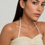 Model wearing the Heart Studs — dainty gold heart stud earrings — Zoé Jewelry.