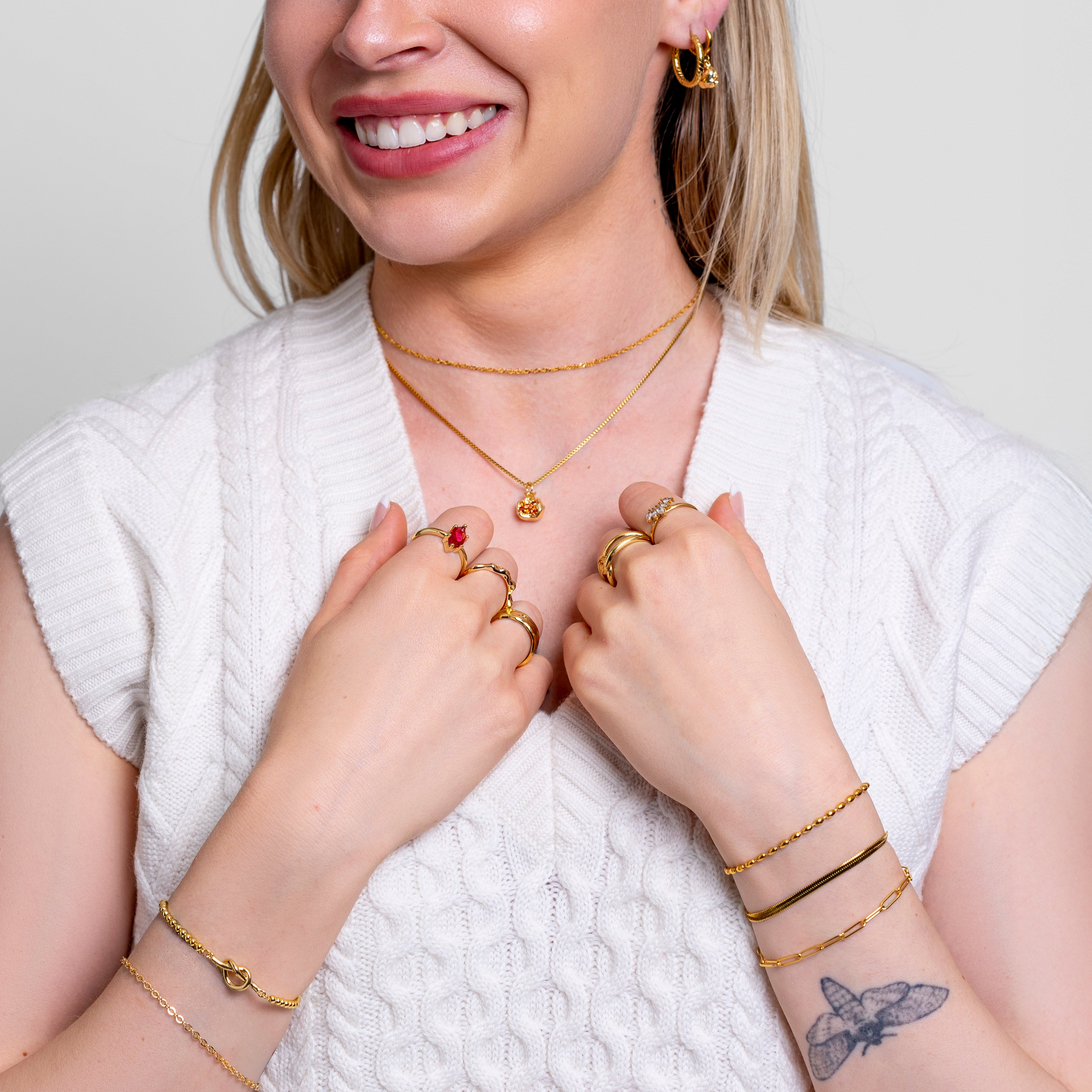 Model wearing Honey Twist chain necklace in 18K gold-plated finish at the collarbone