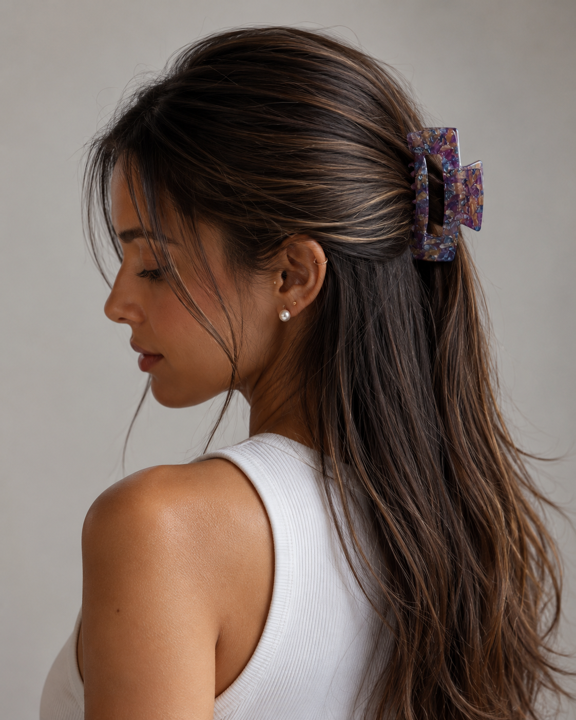 Model wearing the Victoria Large Clip in Lavender Latte holding a half-up twist — a large lavender and latte marbled acetate claw clip from Zoé Jewelry.