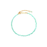 Marisol Bracelet — a dainty strand of faceted natural green gemstone beads on an 18K gold-plated chain with a Zoé bar tag, from Zoé Jewelry.