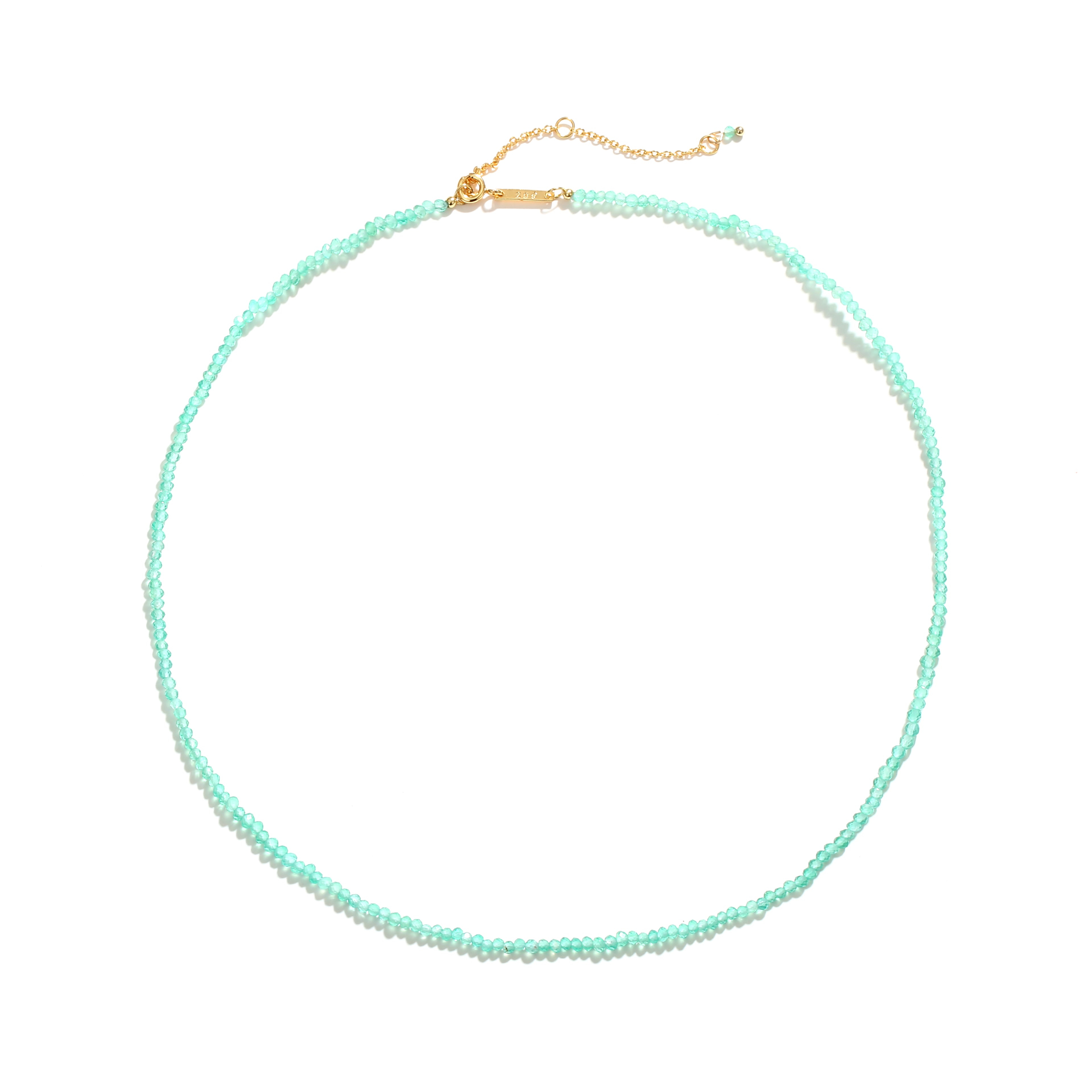 Marisol Necklace laid flat — a dainty strand of faceted natural green gemstone beads on an 18K gold-plated adjustable chain with a Zoé bar tag, from Zoé Jewelry.