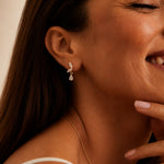 Model wearing Papillon 18K gold butterfly stud earrings, styled for everyday — Zoé Jewelry.