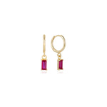 Ruby Huggies — gold huggie hoops with a baguette-cut ruby-pink cubic zirconia drop, shown as a pair, from Zoé Jewelry.