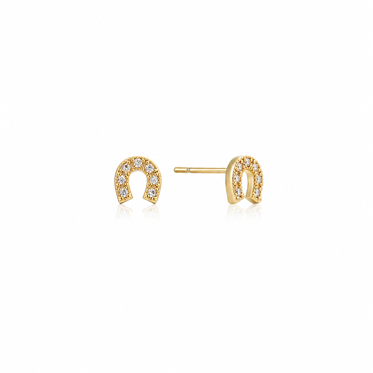 Saddle Up Studs — tiny 18K gold horseshoe stud earrings with pavé cubic zirconia, shown as a pair, from Zoé Jewelry.