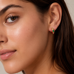 Model wearing the Stardust Hoops with the jewel-toned stone side facing out — reversible 18K gold hoops from Zoé Jewelry.