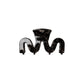 Swiggle wavy claw clip in glossy Noir black with gold fleck cellulose acetate