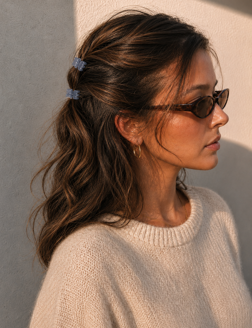  Model wearing two Thea Mini Clips in Cloud in a half-up style — soft blue-grey marbled acetate claw clips from Zoé Jewelry.