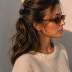  Model wearing two Thea Mini Clips in Cloud in a half-up style — soft blue-grey marbled acetate claw clips from Zoé Jewelry.