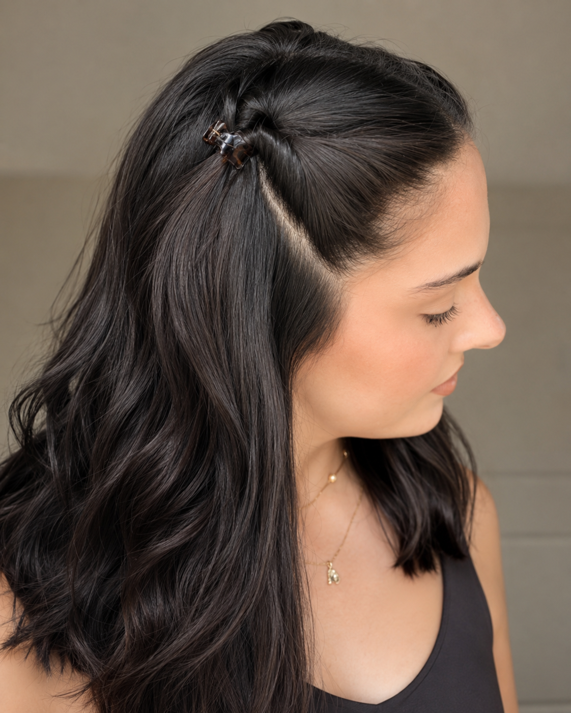Model wearing two Thea Mini Clips in Coco Swirl in a half-up style — warm brown swirled acetate claw clips from Zoé Jewelry.