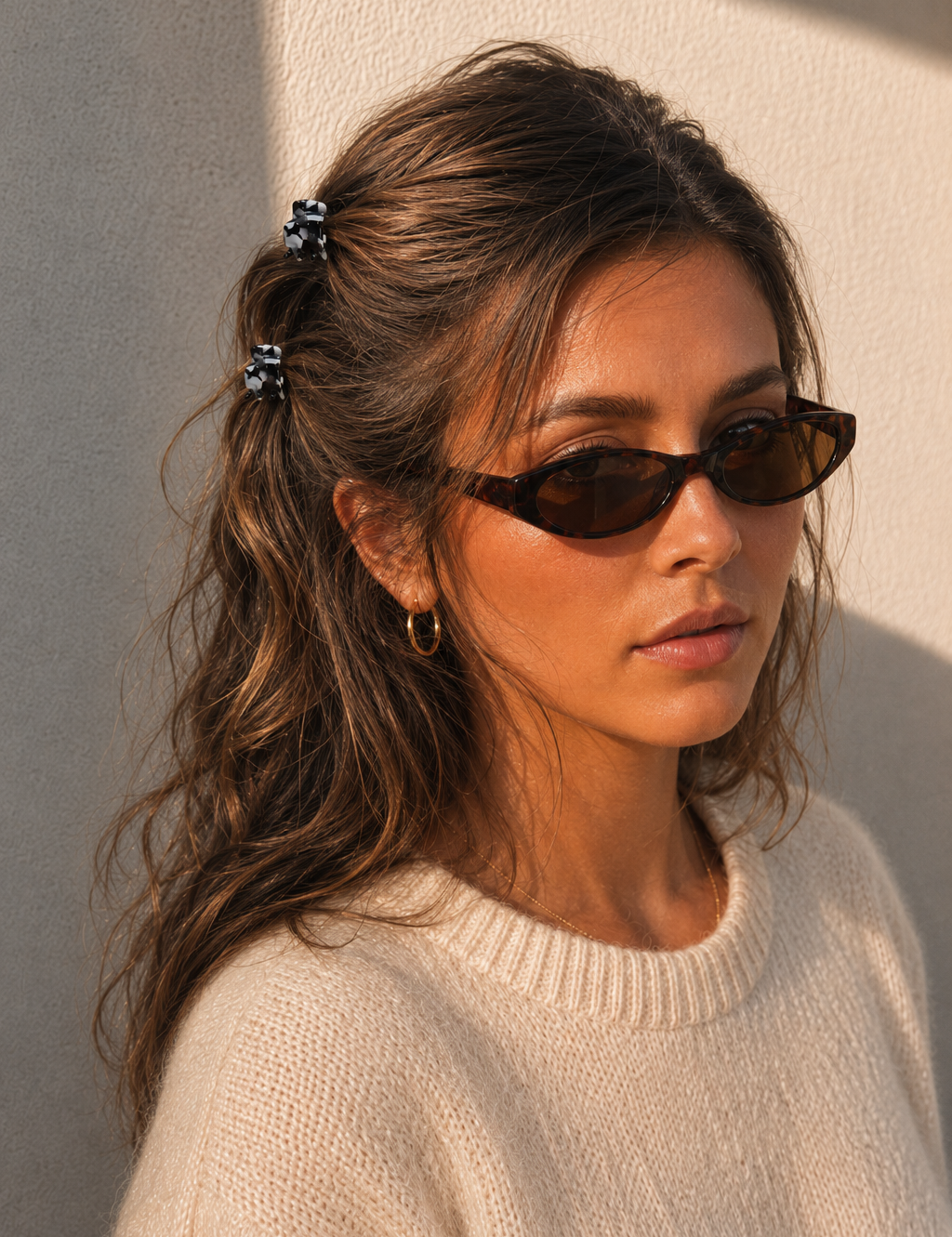  Model wearing two Thea Mini Clips in Monochrome Marble in a half-up style — black and white marbled acetate claw clips from Zoé Jewelry.