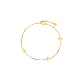 Dainty gold chain bracelet with four-petal flower stations and pearl accents, lobster clasp, adjustable extender, and Zoé disc tag, in 18k gold plating.