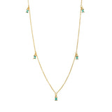 Dainty gold fine chain necklace with green cubic zirconia baguette drops at intervals, in 18k gold plating.