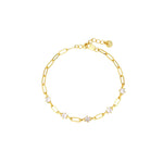 Gold paperclip chain bracelet with five round cubic zirconia stations, lobster clasp, adjustable extender, and Zoé disc tag, in 18k gold plating.