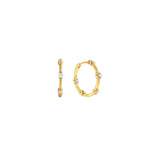 Gold 20mm hoop earrings with round clear cubic zirconia stations, hinged closure, in 18k gold plating.