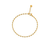 Dainty gold oval-bead chain bracelet with a lobster clasp, adjustable extender, and Zoé disc tag, in 18k gold plating.