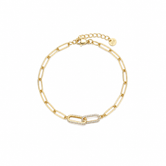 Gold paperclip chain bracelet with a cubic zirconia pavé centre link, lobster clasp, adjustable extender, and Zoé disc tag, in 18k gold plating.